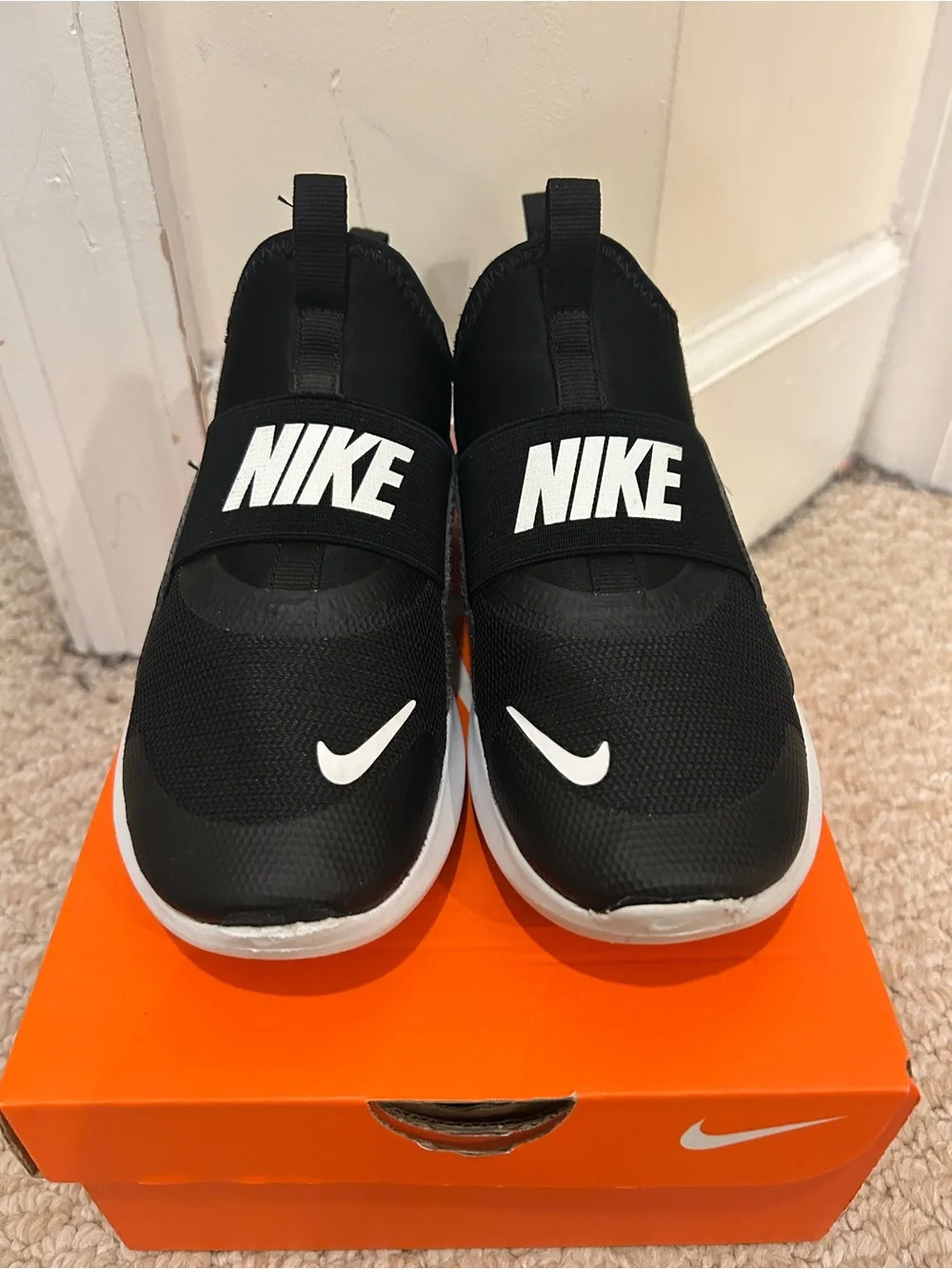 Kids Nike Black and White Slip-Ons
